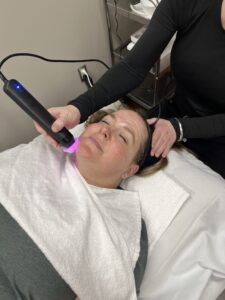 Ageless Solutions patient receiving a Glo2Facial from Chloe.